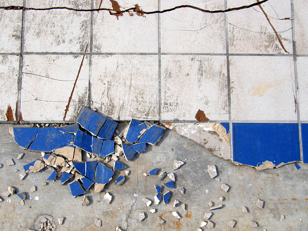 Shattered tile floor of a demolished building