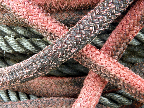 Red, black, white, weather worn dock lines.