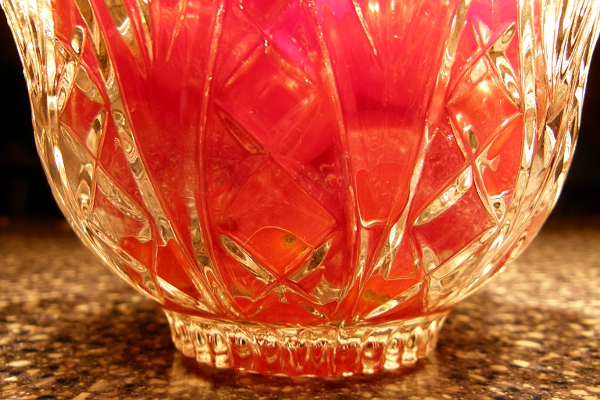 Small tomatoes seen through crystal bowl