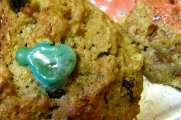 Oatmeal raisin cookies decorated with melted heart shaped candies