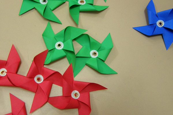 Red, green, and blue paper pinwheel parts