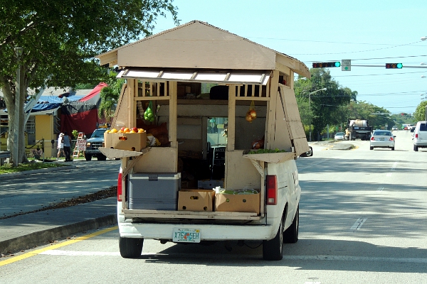Produce vendor truck driving on street