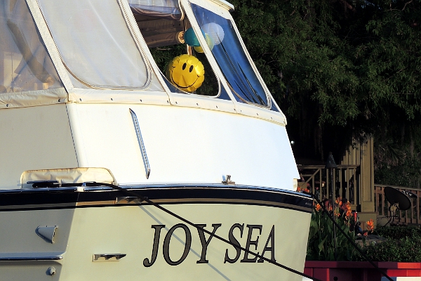 Smiley face balloon on back deck of powerboat