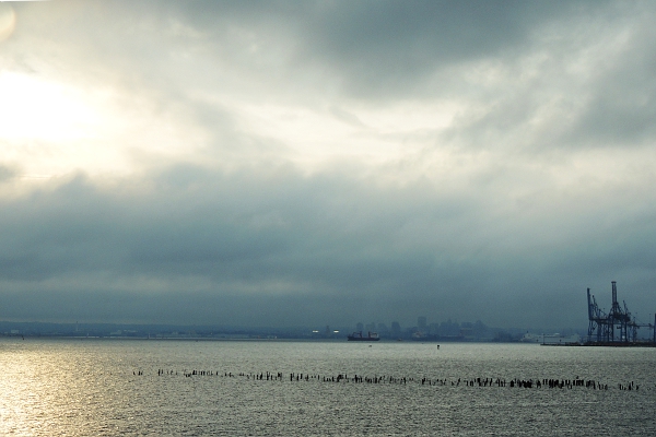 Cloudy rainy day over Chesapeake Bay with sun breaking through the clouds