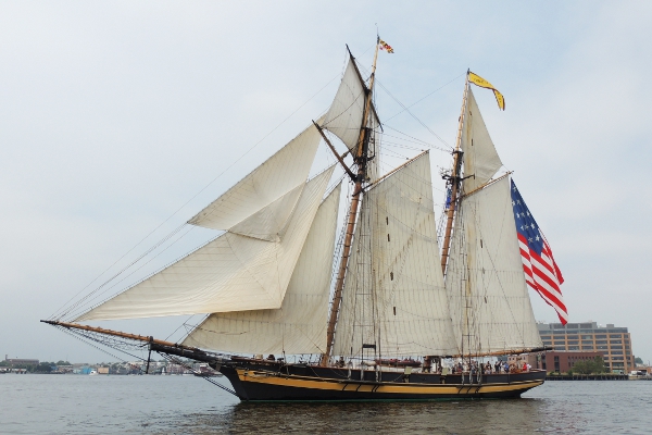 Pride of Baltimore II parading through Baltimore's Inner Harbor