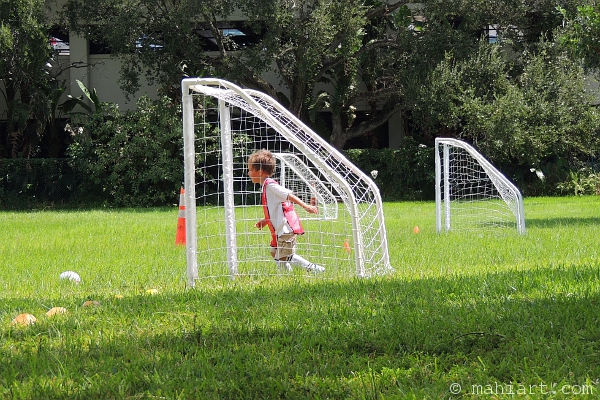 Boy in soccer goal, getting ready for his first match