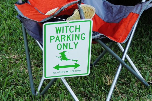 Sign that reads Witch parking only. All others will be toad.