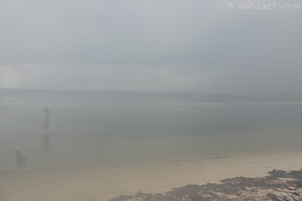 Beach scene on a cloudy day as seen through a fogged up lens