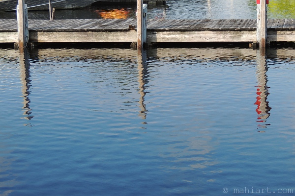 Water coming up very closely underneath dock