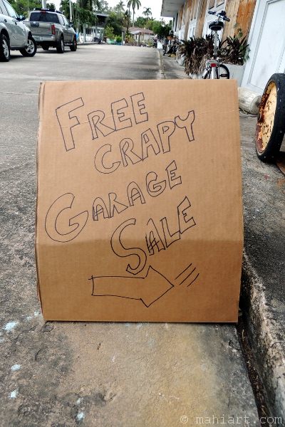 Cardboard garage sale sign
