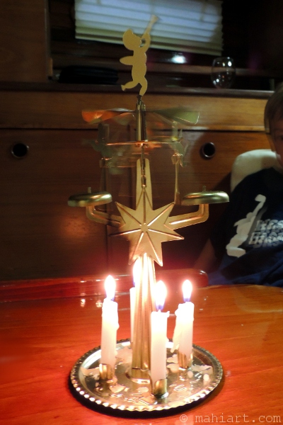 old fashioned angel mobile with candles