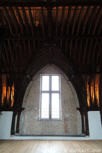 Interior of a pointed arch with wood beam ceiling