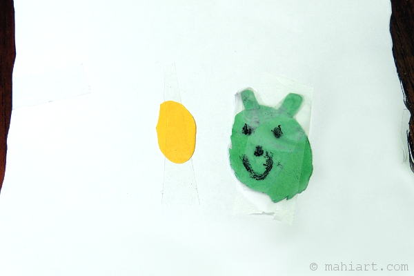 Child's craft of happy pig and egg.