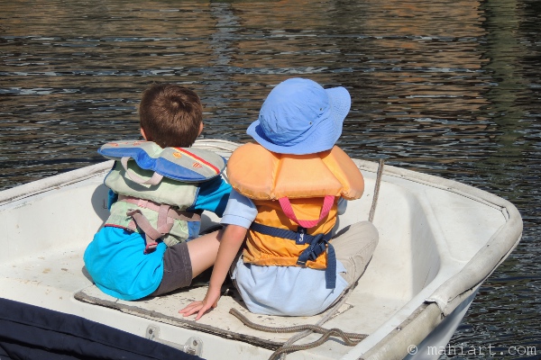 Children sitting in a small boat