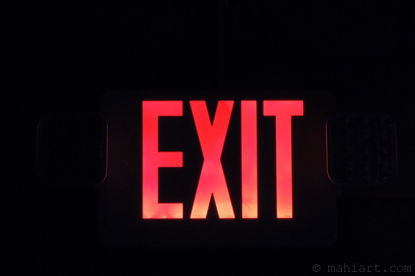 Emergency exit sign in the dark