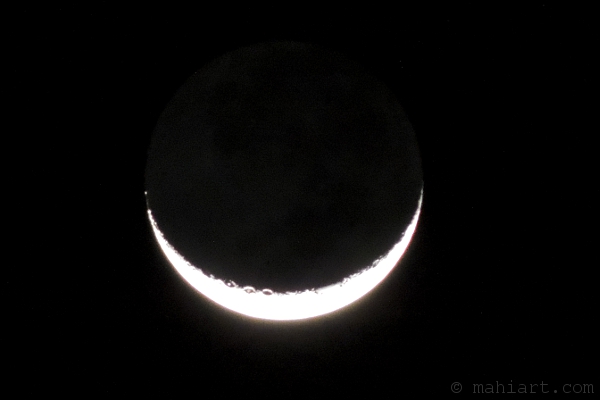 Crescent moon with outlines of craters