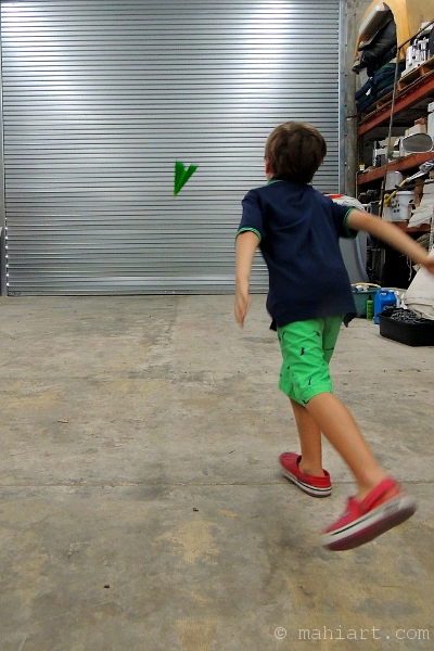 Boy throwing a paper airplane