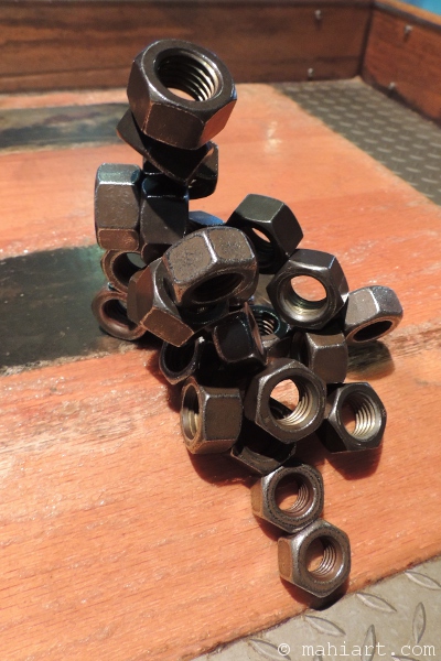 Magnetic sculpture made of large hex nuts