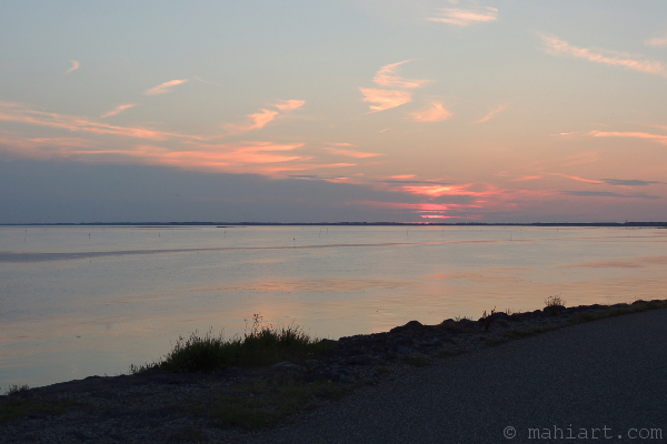 Sunset over the water of the Oosterschelde, as seen from the dike near Zierikzee