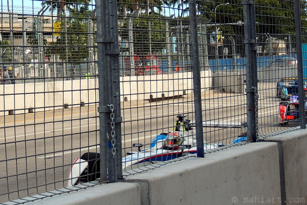 Forumula E race in Miami, seen through safety fence
