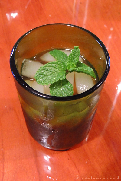 Drink topped with fresh mint leaves