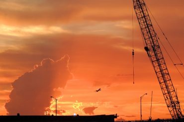 Today’s inlet: Crane, plane, cloud.