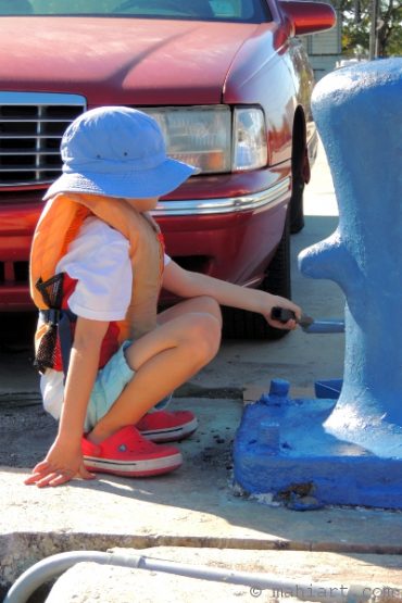 Painting the bollards blue.