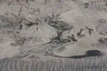 In the sand.